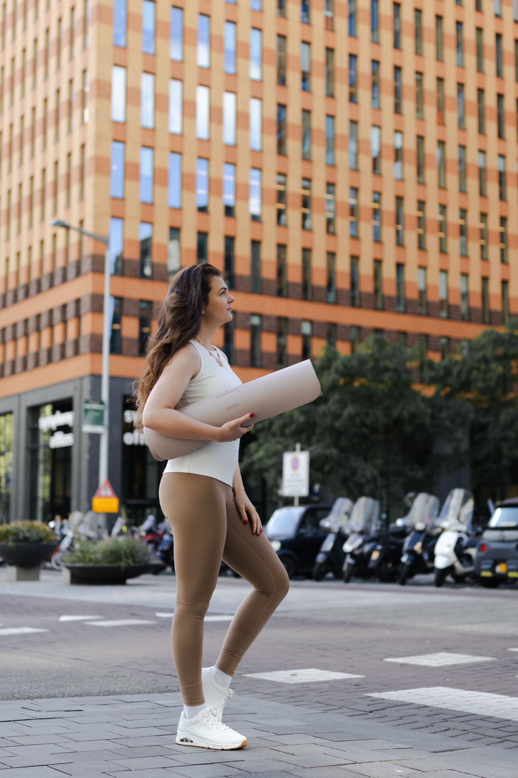 A beginner Mat Pilates moment, mat in hand